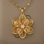 Kaulakoru-riipus, jossa on kaunis pyörivä kukka, stressiä lievittävä