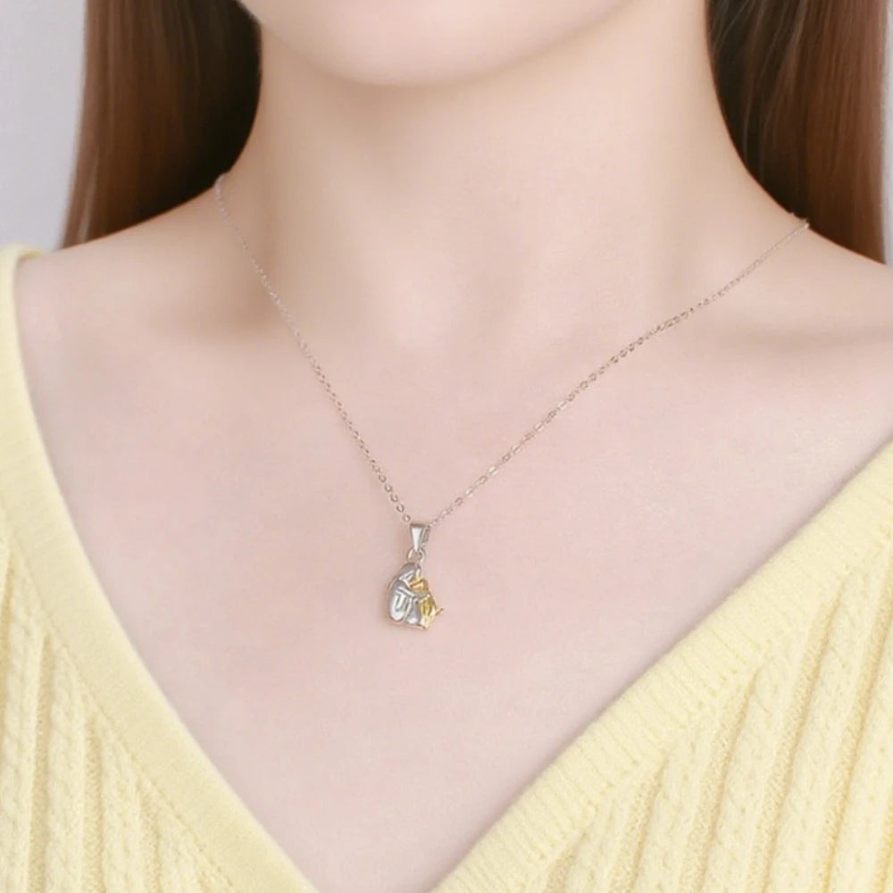 Halauskoiran ja isännän riipuskaulakoru 