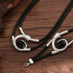 Hopeiset geometriset riipuskaulakoru ja rannekoru