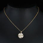 Kultainen pyörivä stressiä lievittävä kukka zirkonikorupendantti kaulakorussa