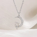 Kuu- ja kissariipus kaulakorussa, jossa kristalli