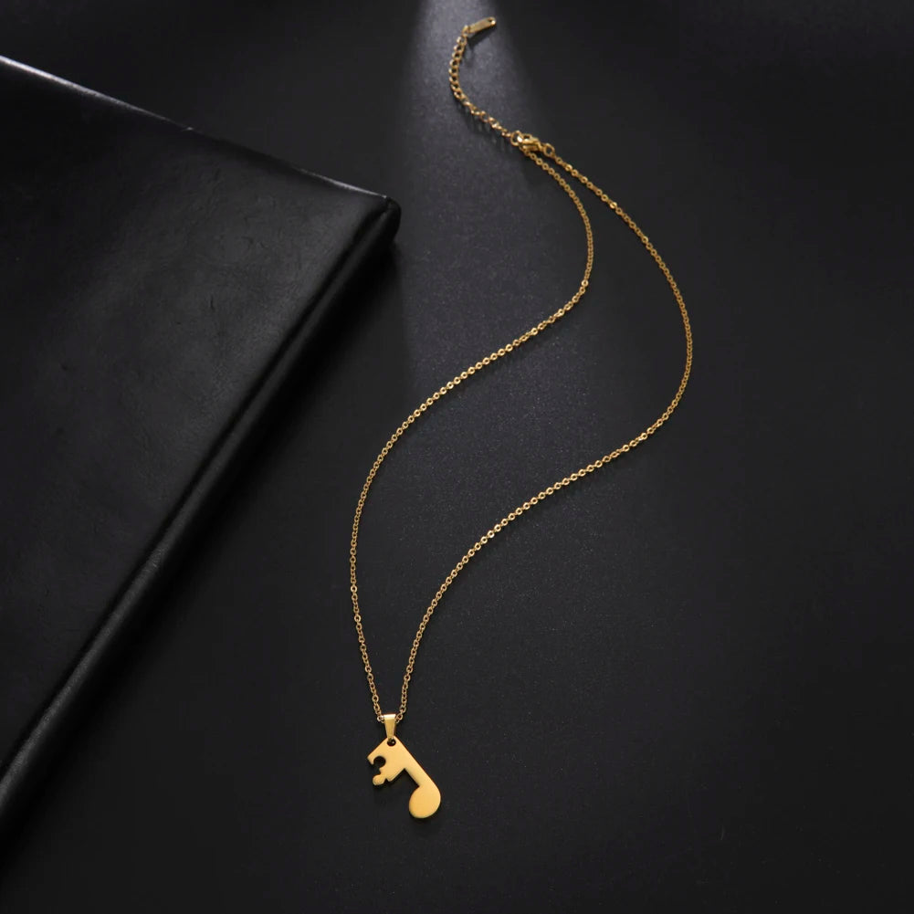 Pariskuntien kaulakorut kultainen nuottiriipus