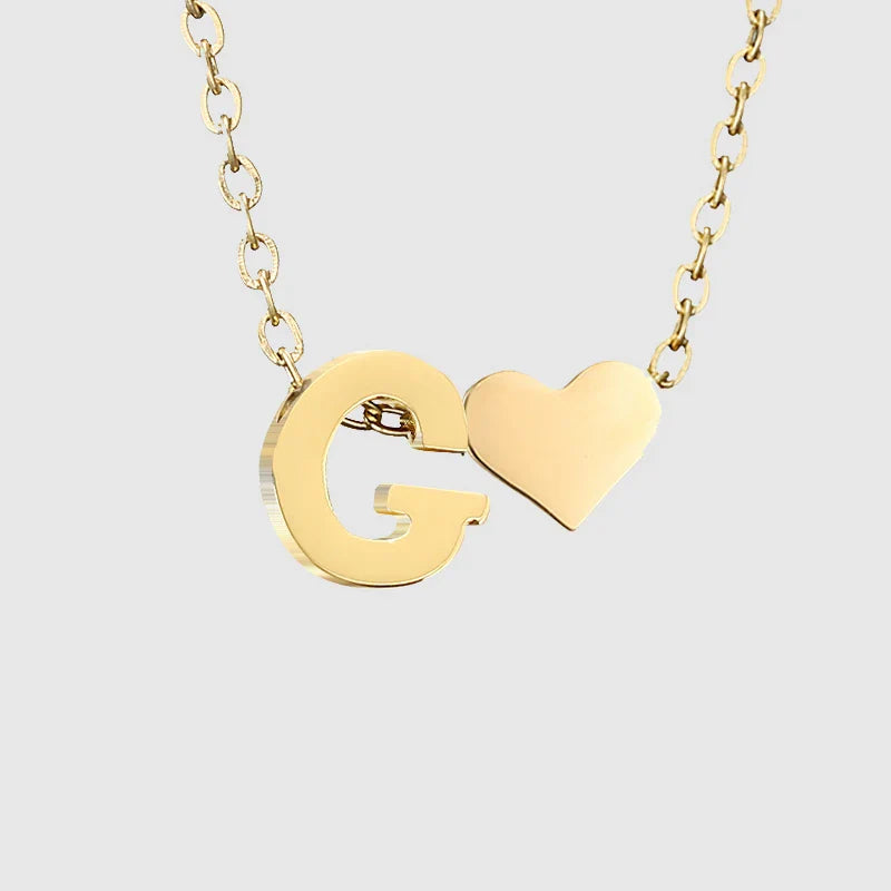 Naisten kaulakoru sydänriipuksella ja nimikirjaimella - kirjain 