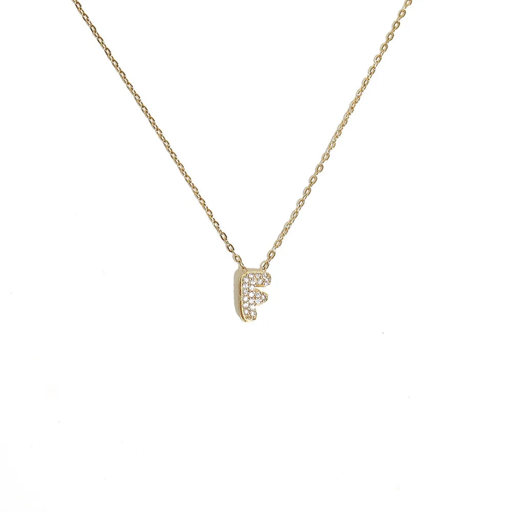 Naisen choker-kaulakoru minimalistisella f-kirjaimen riipuksella