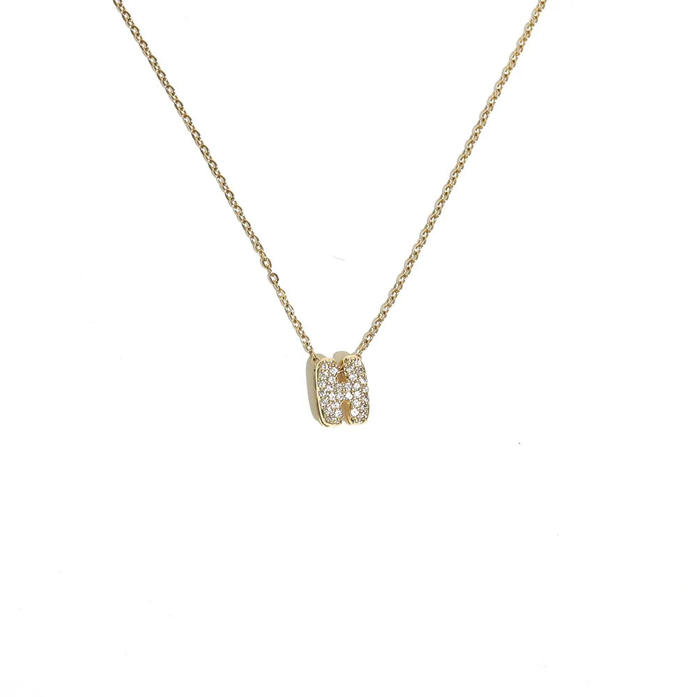 Naisen choker-kaulakoru minimalistisella h-kirjaimen riipuksella