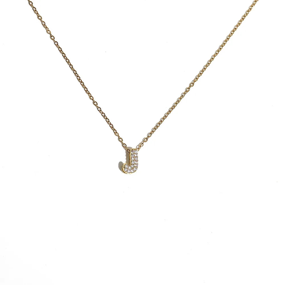 Naisen choker-kaulakoru minimalistisella j-kirjaimen riipuksella