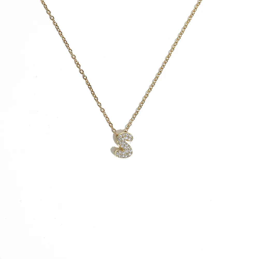 Naisen choker-kaulakoru minimalistisella s-kirjaimen riipuksella