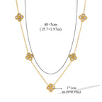 Kaulakoru, jossa on nelilehtinen apila -riipukset