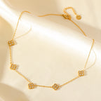 Kaulakoru, jossa on nelilehtinen apila -riipukset