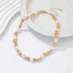 Kaulakoru helmiriipuksilla naisille kulta