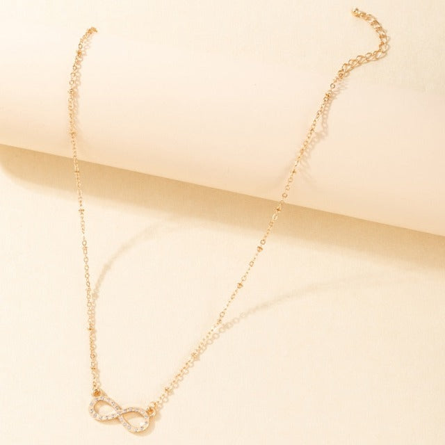 Naisten kultainen äärettömyysmerkkiriipus kaulakoru