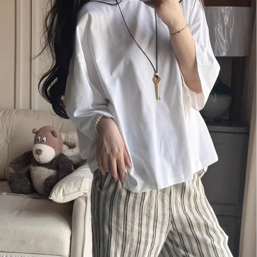 Pitkä köysikaulakoru avainriipuksella