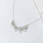 Nelilehtisen apilan sydänkaulakoru onnenamuletilla hopeasta