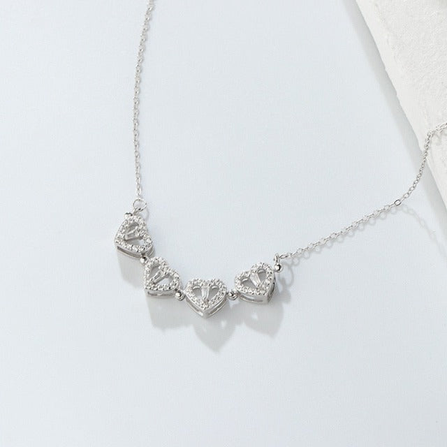 Nelilehtisen apilan sydänkaulakoru onnenamuletilla hopeasta